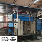 Mobilna kotłownia kontenerowa Binder o mocy 840 kW od Płomex-Pol z widoczną szafą sterowniczą i instalacją przemysłową.